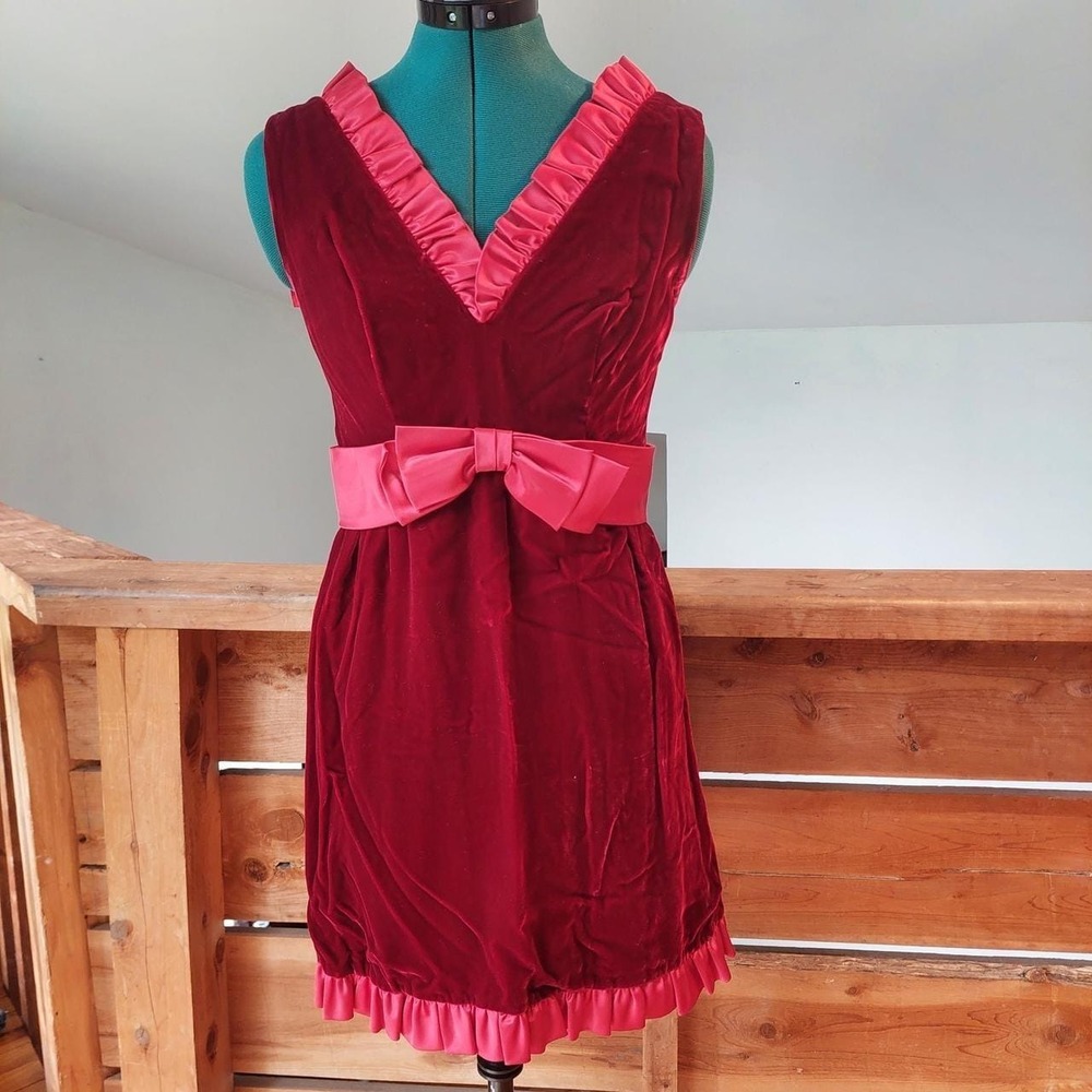 Vintage homemade red velvet dress with bow and ruffle detail.